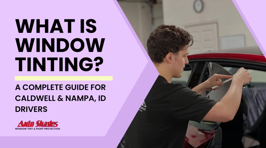 A window tinting technician carefully applies film to a car window in a garage, illustrating the process for local drivers researching What is Window Tinting in Caldwell and Nampa, Idaho.